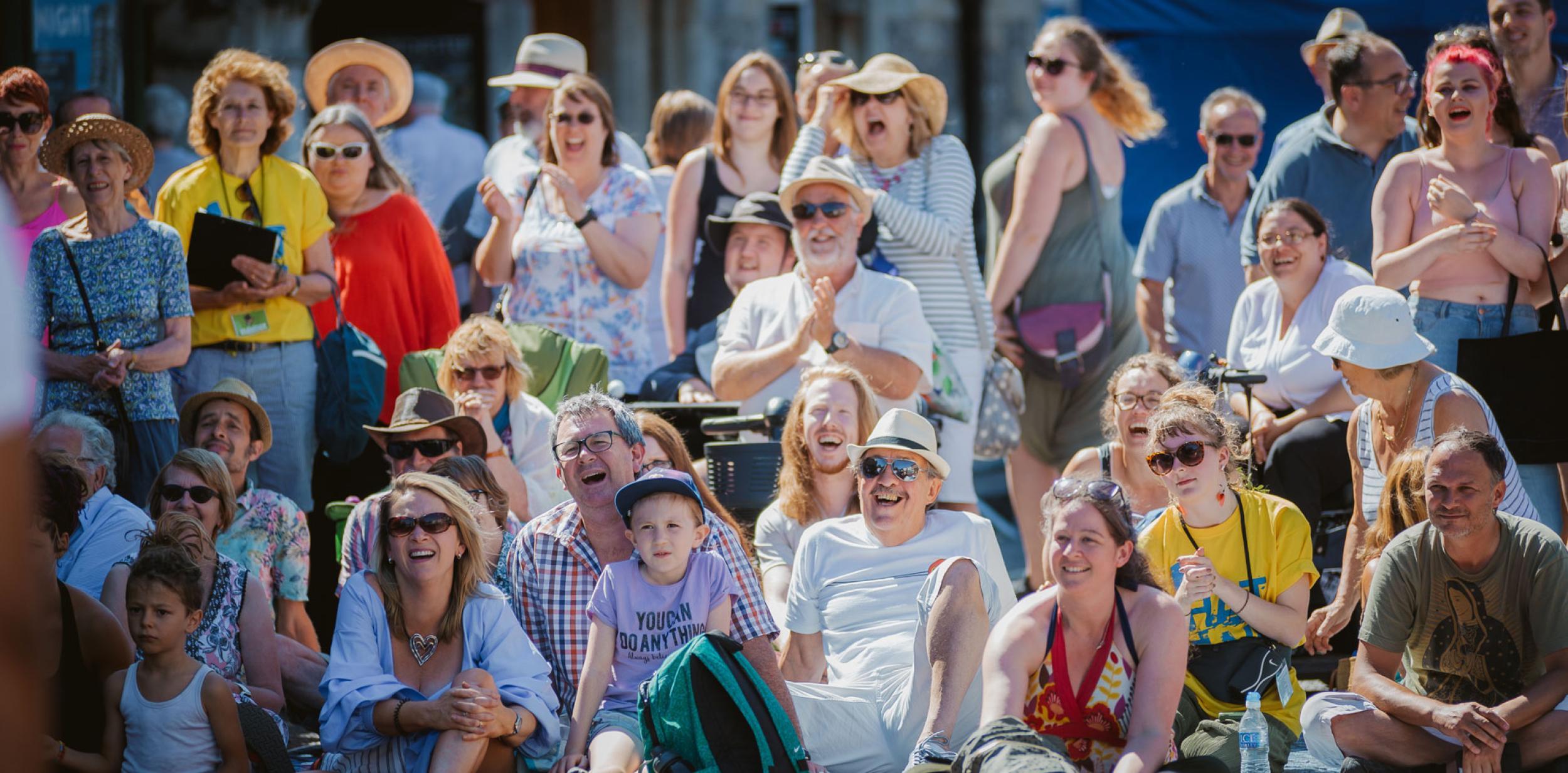 Audience members laughing