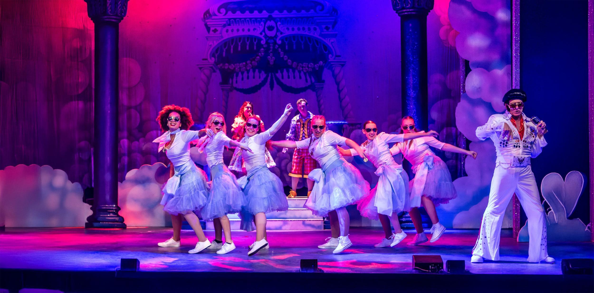 Young performers dancing with "Elvis"
