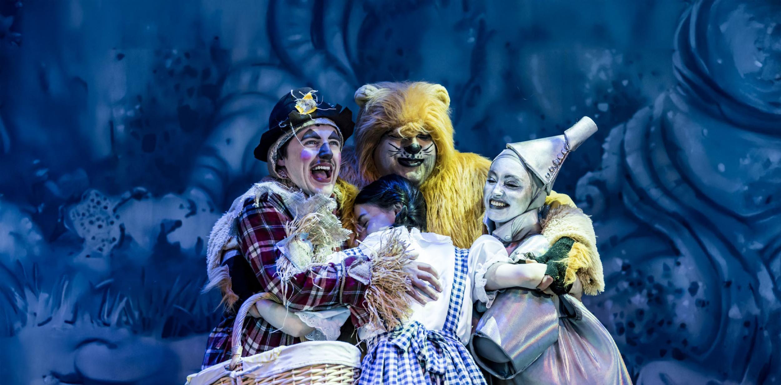 Panto cuddle with Dorothy, the Scarecrow, the Tinman and the Lion all hugging