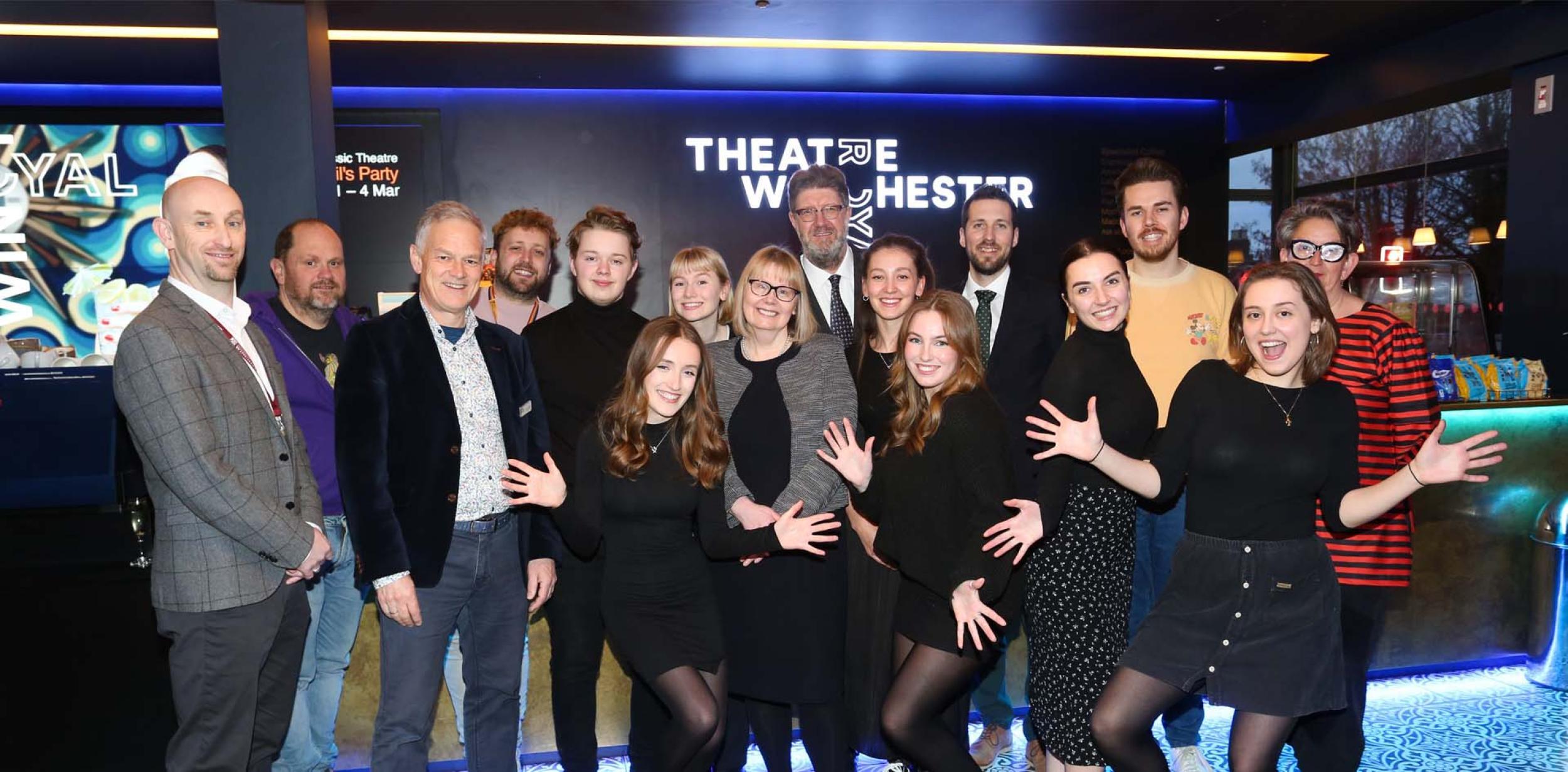 A group photo in Theatre Royal Winchester's foyer, with students from the University of Winchester