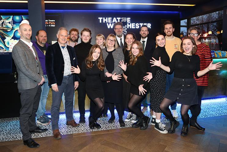 A group photo in Theatre Royal Winchester's foyer, with students from the University of Winchester