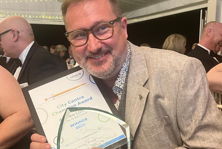 Andrew Loretto with his award.
