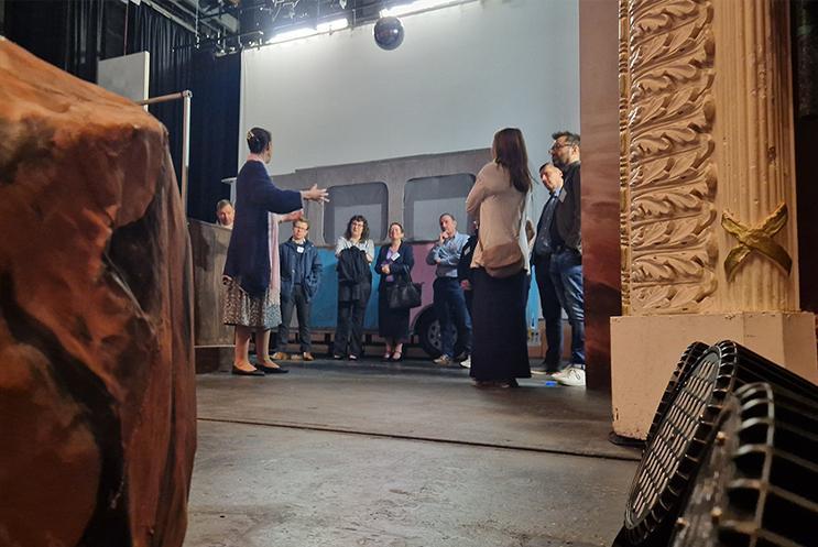 Business professionals on a backstage tour