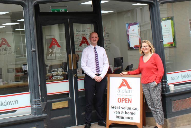 A-Plan's Ian Tuffrey standing outside the branch with Play to the Crowd's Kirstie Mathieson