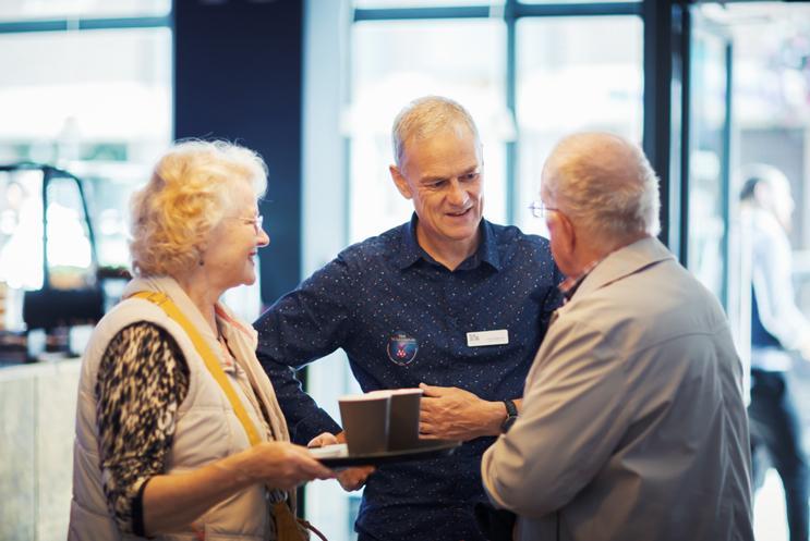 Deryck chatting to customers