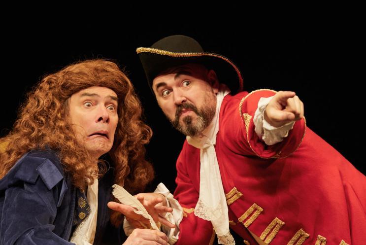 Two historical men gesturing and pointing into the distance 