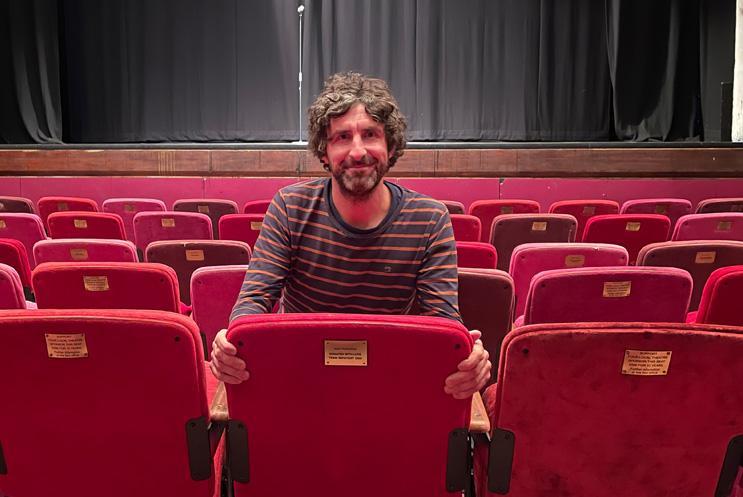 Mark Watson sat in a seat at Theatre Royal Winchester