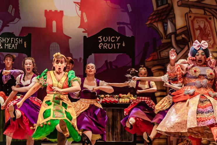 Panto performers dancing on stage