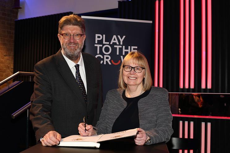 Mark Byford, Play to the Crowd’s Chair of Trustees; and Vice Chancellor of University of Winchester Professor Sarah Greer signing the partnership agreement